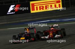 Daniel Ricciardo (AUS) Red Bull Racing RB10 and Kimi Raikkonen (FIN) Ferrari F14-T. 06.04.2014. Formula 1 World Championship, Rd 3, Bahrain Grand Prix, Sakhir, Bahrain, Race Day.