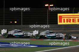 Nico Rosberg (GER) Mercedes AMG F1 W05 and team mate Lewis Hamilton (GBR) Mercedes AMG F1 W05 battle for position. 06.04.2014. Formula 1 World Championship, Rd 3, Bahrain Grand Prix, Sakhir, Bahrain, Race Day.