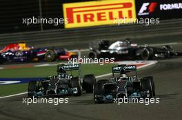 Nico Rosberg (GER) Mercedes AMG F1 and Lewis Hamilton (GBR) Mercedes AMG F1 W05. 06.04.2014. Formula 1 World Championship, Rd 3, Bahrain Grand Prix, Sakhir, Bahrain, Race Day.