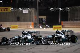 (L to R): Lewis Hamilton (GBR) Mercedes AMG F1 W05 and team mate Nico Rosberg (GER) Mercedes AMG F1 W05 battle for position. 06.04.2014. Formula 1 World Championship, Rd 3, Bahrain Grand Prix, Sakhir, Bahrain, Race Day.