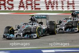 Lewis Hamilton (GBR), Mercedes AMG F1 Team and Nico Rosberg (GER), Mercedes AMG F1 Team  06.04.2014. Formula 1 World Championship, Rd 3, Bahrain Grand Prix, Sakhir, Bahrain, Race Day.