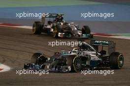 Lewis Hamilton (GBR) Mercedes AMG F1 W05 leads team mate Nico Rosberg (GER) Mercedes AMG F1 W05. 06.04.2014. Formula 1 World Championship, Rd 3, Bahrain Grand Prix, Sakhir, Bahrain, Race Day.