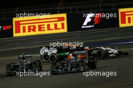 Nico Rosberg (GER) Mercedes AMG F1 and Lewis Hamilton (GBR) Mercedes AMG F1 W05. 06.04.2014. Formula 1 World Championship, Rd 3, Bahrain Grand Prix, Sakhir, Bahrain, Race Day.