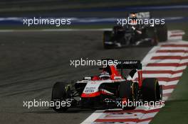 Jules Bianchi (FRA) Marussia F1 Team MR03 and Adrian Sutil (GER) Sauber C33. 06.04.2014. Formula 1 World Championship, Rd 3, Bahrain Grand Prix, Sakhir, Bahrain, Race Day.