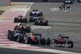 Daniel Ricciardo (AUS) Red Bull Racing RB10 and Daniil Kvyat (RUS) Scuderia Toro Rosso STR9 at the start of the race. 06.04.2014. Formula 1 World Championship, Rd 3, Bahrain Grand Prix, Sakhir, Bahrain, Race Day.