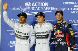 Qualifying top three in parc ferme (L to R): Lewis Hamilton (GBR) Mercedes AMG F1, second; Nico Rosberg (GER) Mercedes AMG F1, pole position; Daniel Ricciardo (AUS) Red Bull Racing, third. 05.04.2014. Formula 1 World Championship, Rd 3, Bahrain Grand Prix, Sakhir, Bahrain, Qualifying Day.