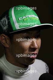 Kamui Kobayashi (JPN) Caterham with the media. 05.04.2014. Formula 1 World Championship, Rd 3, Bahrain Grand Prix, Sakhir, Bahrain, Qualifying Day.