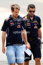 Sebastian Vettel (GER) Red Bull Racing walks the circuit with Guillaume Rocquelin (ITA) Red Bull Racing Race Engineer. 03.04.2014. Formula 1 World Championship, Rd 3, Bahrain Grand Prix, Sakhir, Bahrain, Preparation Day.