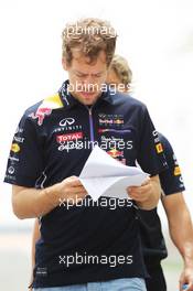 Sebastian Vettel (GER) Red Bull Racing walks the circuit. 03.04.2014. Formula 1 World Championship, Rd 3, Bahrain Grand Prix, Sakhir, Bahrain, Preparation Day.