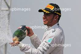 Nico Rosberg (GER) Mercedes AMG F1 celebrates his second position on the podium. 09.11.2014. Formula 1 World Championship, Rd 18, Brazilian Grand Prix, Sao Paulo, Brazil, Race Day.