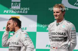 The podium (L to R): second placed Lewis Hamilton (GBR) Mercedes AMG F1 with race winner and team mate Nico Rosberg (GER) Mercedes AMG F1. 09.11.2014. Formula 1 World Championship, Rd 18, Brazilian Grand Prix, Sao Paulo, Brazil, Race Day.