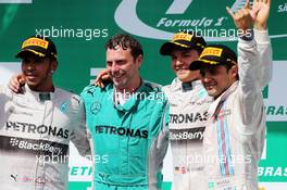 The podium (L to R): Lewis Hamilton (GBR) Mercedes AMG F1, second; Matt Deane (GBR) Mercedes AMG F1 Race Engineer; Nico Rosberg (GER) Mercedes AMG F1, race winner; Felipe Massa (BRA) Williams, third. 09.11.2014. Formula 1 World Championship, Rd 18, Brazilian Grand Prix, Sao Paulo, Brazil, Race Day.