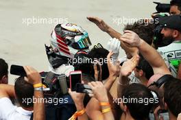 Lewis Hamilton (GBR) Mercedes AMG F1 celebrates his second position in parc ferme. 09.11.2014. Formula 1 World Championship, Rd 18, Brazilian Grand Prix, Sao Paulo, Brazil, Race Day.
