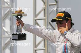Felipe Massa (BRA) Williams celebrates his third position on the podium. 09.11.2014. Formula 1 World Championship, Rd 18, Brazilian Grand Prix, Sao Paulo, Brazil, Race Day.