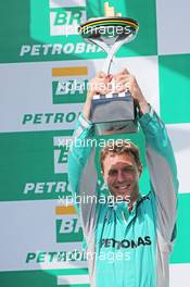 Matt Deane (GBR) Mercedes AMG F1 Race Engineer celebrates on the podium. 09.11.2014. Formula 1 World Championship, Rd 18, Brazilian Grand Prix, Sao Paulo, Brazil, Race Day.