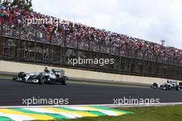 Nico Rosberg (GER) Mercedes AMG F1 W05 and Lewis Hamilton (GBR) Mercedes AMG F1. 09.11.2014. Formula 1 World Championship, Rd 18, Brazilian Grand Prix, Sao Paulo, Brazil, Race Day.