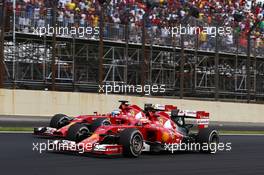 Fernando Alonso (ESP) Ferrari F14-T and Kimi Raikkonen (FIN). 09.11.2014. Formula 1 World Championship, Rd 18, Brazilian Grand Prix, Sao Paulo, Brazil, Race Day.