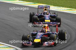 Sebastian Vettel (GER) Red Bull Racing RB10 leads team mate Daniel Ricciardo (AUS) Red Bull Racing RB10. 09.11.2014. Formula 1 World Championship, Rd 18, Brazilian Grand Prix, Sao Paulo, Brazil, Race Day.