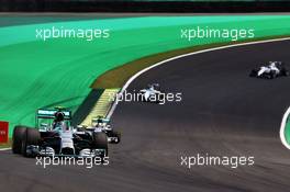 Nico Rosberg (GER) Mercedes AMG F1 W05 leads Lewis Hamilton (GBR) Mercedes AMG F1 W05. 09.11.2014. Formula 1 World Championship, Rd 18, Brazilian Grand Prix, Sao Paulo, Brazil, Race Day.