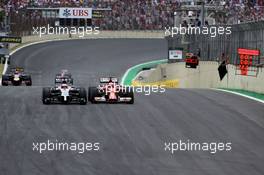 Jenson Button (GBR), McLaren F1 Team and Kimi Raikkonen (FIN), Scuderia Ferrari  09.11.2014. Formula 1 World Championship, Rd 18, Brazilian Grand Prix, Sao Paulo, Brazil, Race Day.