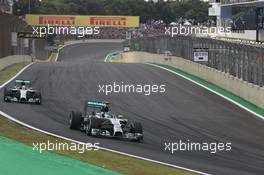Nico Rosberg (GER), Mercedes AMG F1 Team and Lewis Hamilton (GBR), Mercedes AMG F1 Team  09.11.2014. Formula 1 World Championship, Rd 18, Brazilian Grand Prix, Sao Paulo, Brazil, Race Day.