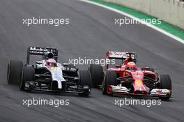 Jenson Button (GBR), McLaren F1 Team and Kimi Raikkonen (FIN), Scuderia Ferrari  09.11.2014. Formula 1 World Championship, Rd 18, Brazilian Grand Prix, Sao Paulo, Brazil, Race Day.
