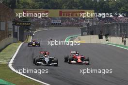 Adrian Sutil (GER), Sauber F1 Team and Kimi Raikkonen (FIN), Scuderia Ferrari  09.11.2014. Formula 1 World Championship, Rd 18, Brazilian Grand Prix, Sao Paulo, Brazil, Race Day.