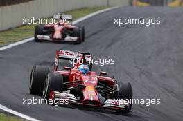 Fernando Alonso (ESP), Scuderia Ferrari and Kimi Raikkonen (FIN), Scuderia Ferrari  09.11.2014. Formula 1 World Championship, Rd 18, Brazilian Grand Prix, Sao Paulo, Brazil, Race Day.