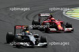 Esteban Gutierrez (MEX) Sauber C33 leads Kimi Raikkonen (FIN) Ferrari F14-T. 09.11.2014. Formula 1 World Championship, Rd 18, Brazilian Grand Prix, Sao Paulo, Brazil, Race Day.