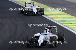 Felipe Massa (BRA) Williams FW36 leads team mate Valtteri Bottas (FIN) Williams FW36. 09.11.2014. Formula 1 World Championship, Rd 18, Brazilian Grand Prix, Sao Paulo, Brazil, Race Day.
