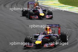 Sebastian Vettel (GER) Red Bull Racing RB10 leads team mate Daniel Ricciardo (AUS) Red Bull Racing RB10. 09.11.2014. Formula 1 World Championship, Rd 18, Brazilian Grand Prix, Sao Paulo, Brazil, Race Day.