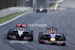 Daniil Kvyat (RUS), Scuderia Toro Rosso and Sebastian Vettel (GER), Red Bull Racing  09.11.2014. Formula 1 World Championship, Rd 18, Brazilian Grand Prix, Sao Paulo, Brazil, Race Day.