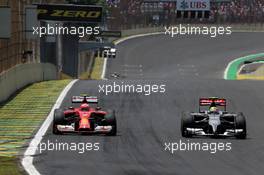 Kimi Raikkonen (FIN), Scuderia Ferrari and Esteban Gutierrez (MEX), Sauber F1 Team  09.11.2014. Formula 1 World Championship, Rd 18, Brazilian Grand Prix, Sao Paulo, Brazil, Race Day.