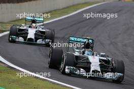 Nico Rosberg (GER), Mercedes AMG F1 Team and Lewis Hamilton (GBR), Mercedes AMG F1 Team  09.11.2014. Formula 1 World Championship, Rd 18, Brazilian Grand Prix, Sao Paulo, Brazil, Race Day.