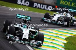 Nico Rosberg (GER) Mercedes AMG F1 W05 leads Lewis Hamilton (GBR) Mercedes AMG F1 W05. 09.11.2014. Formula 1 World Championship, Rd 18, Brazilian Grand Prix, Sao Paulo, Brazil, Race Day.