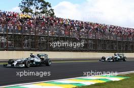 Nico Rosberg (GER) Mercedes AMG F1 W05 and Lewis Hamilton (GBR) Mercedes AMG F1 W05. 09.11.2014. Formula 1 World Championship, Rd 18, Brazilian Grand Prix, Sao Paulo, Brazil, Race Day.