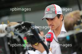 Adrian Sutil (GER) Sauber with the media. 06.11.2014. Formula 1 World Championship, Rd 18, Brazilian Grand Prix, Sao Paulo, Brazil, Preparation Day.