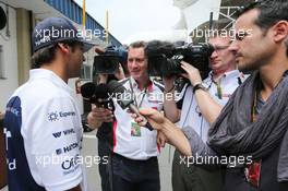 (L to R): Felipe Nasr (BRA) Williams Test and Reserve Driver with Craig Slater (GBR) Sky F1 Reporter. 06.11.2014. Formula 1 World Championship, Rd 18, Brazilian Grand Prix, Sao Paulo, Brazil, Preparation Day.