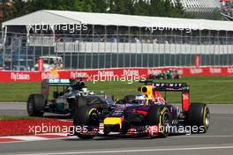 Sebastian Vettel (GER) Red Bull Racing RB10 leads Lewis Hamilton (GBR) Mercedes AMG F1 W05. 06.06.2014. Formula 1 World Championship, Rd 7, Canadian Grand Prix, Montreal, Canada, Practice Day.