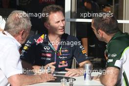 Dr Helmut Marko (AUT) Red Bull Motorsport Consultant, Christian Horner (GBR), Red Bull Racing, Sporting Director and Cyril Abiteboul (FRA), Team Principal, Caterham F1 Team  06.06.2014. Formula 1 World Championship, Rd 7, Canadian Grand Prix, Montreal, Canada, Practice Day.