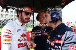 Jean-Eric Vergne (FRA) Scuderia Toro Rosso on the grid with Xevi Pujolar (ESP) Scuderia Toro Rosso Race Engineer. 08.06.2014. Formula 1 World Championship, Rd 7, Canadian Grand Prix, Montreal, Canada, Race Day.