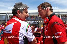 (L to R): Marco Mattiacci (ITA) Ferrari Team Principal with Renato Bisignani (ITA) Ferrari Head of Communications on the grid. 08.06.2014. Formula 1 World Championship, Rd 7, Canadian Grand Prix, Montreal, Canada, Race Day.
