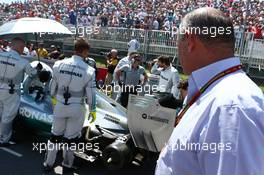 Ron Dennis (GBR) McLaren Executive Chairman looks at the Mercedes AMG F1 W05 on the grid. 08.06.2014. Formula 1 World Championship, Rd 7, Canadian Grand Prix, Montreal, Canada, Race Day.