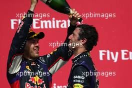 3rd place Sebastian Vettel (GER) Red Bull Racing with 1st place Daniel Ricciardo (AUS) Red Bull Racing RB10. 08.06.2014. Formula 1 World Championship, Rd 7, Canadian Grand Prix, Montreal, Canada, Race Day.