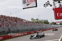 Second placed Nico Rosberg (GER) Mercedes AMG F1 W05 takes the chequered flag at the end of the race. 08.06.2014. Formula 1 World Championship, Rd 7, Canadian Grand Prix, Montreal, Canada, Race Day.