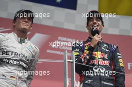 Race winner Daniel Ricciardo (AUS) Red Bull Racing on the podium with Nico Rosberg (GER) Mercedes AMG F1 (Left). 08.06.2014. Formula 1 World Championship, Rd 7, Canadian Grand Prix, Montreal, Canada, Race Day.
