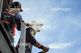 Race winner Daniel Ricciardo (AUS) Red Bull Racing celebrates on the podium with team mate Sebastian Vettel (GER) Red Bull Racing. 08.06.2014. Formula 1 World Championship, Rd 7, Canadian Grand Prix, Montreal, Canada, Race Day.