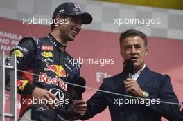 Race winner Daniel Ricciardo (AUS) Red Bull Racing with Jean Alesi (FRA) on the podium. 08.06.2014. Formula 1 World Championship, Rd 7, Canadian Grand Prix, Montreal, Canada, Race Day.