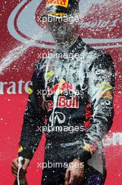 Race winner Daniel Ricciardo (AUS) Red Bull Racing celebrates with the champagne on the podium. 08.06.2014. Formula 1 World Championship, Rd 7, Canadian Grand Prix, Montreal, Canada, Race Day.