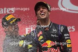 Race winner Daniel Ricciardo (AUS) Red Bull Racing celebrates on the podium with team mate Sebastian Vettel (GER) Red Bull Racing. 08.06.2014. Formula 1 World Championship, Rd 7, Canadian Grand Prix, Montreal, Canada, Race Day.